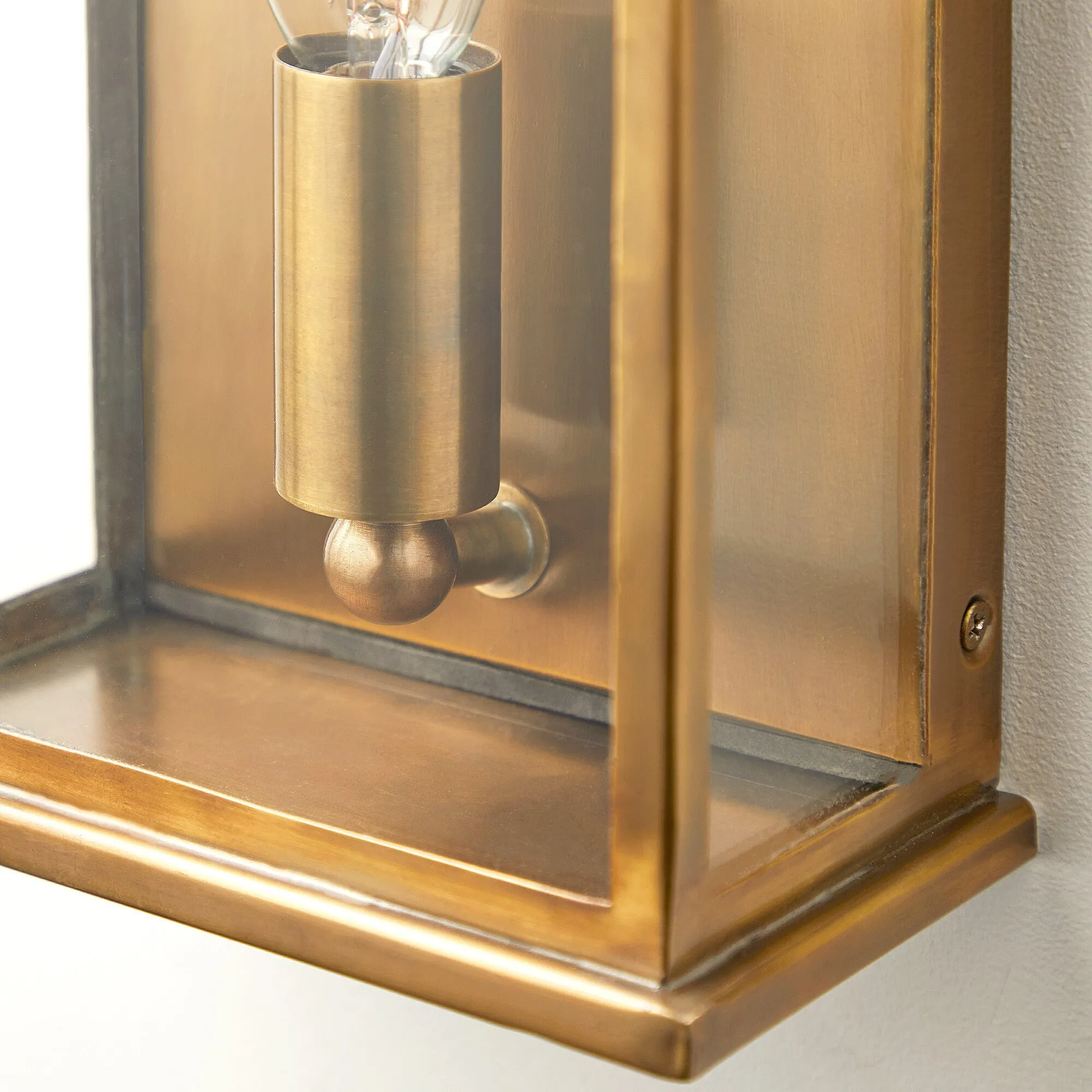 Tenby exterior IP44 wall light in antiqued brass